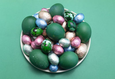 High angle view of blueberries on blue background