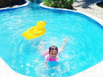 High angle view of woman swimming in pool