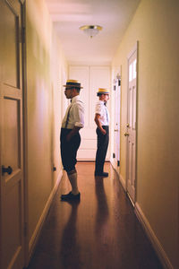 People walking in corridor of building