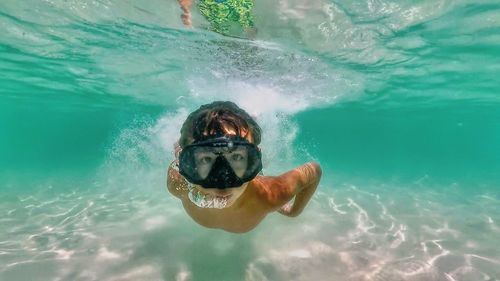 Portrait of man swimming in pool