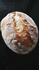 High angle view of bread on table against black background