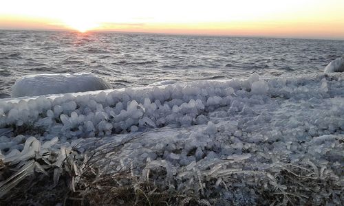 Scenic view of sea against sky during sunset