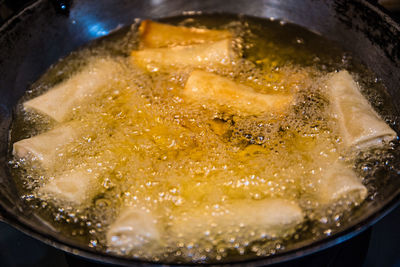 High angle view of meat in cooking pan