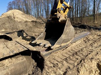 Excavator in field work