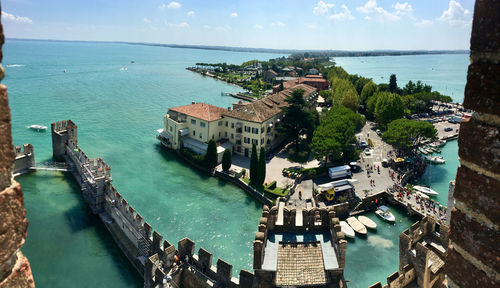 High angle view of buildings by sea