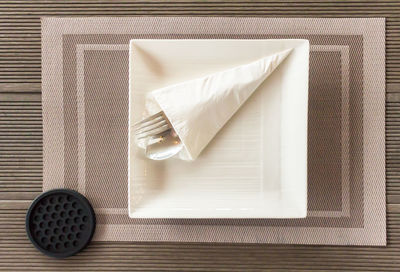 High angle view of bread on white table