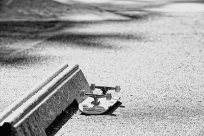 Low angle view of toy on the asphalt in skate park 