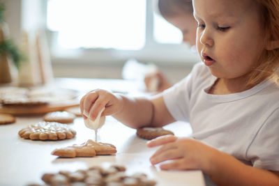 Close-up of girl making cookies