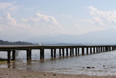 Pier over sea against sky