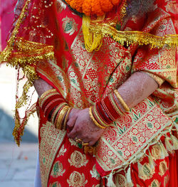 Midsection of woman in traditional clothing