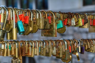 Close-up of love padlocks hanging in city