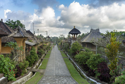 Panoramic view of temple amidst buildings against sky