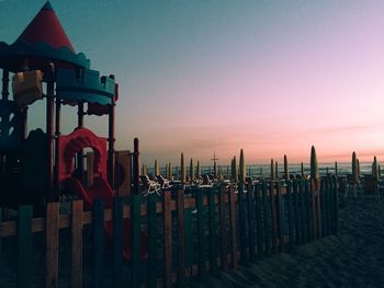 Lifeguard hut at beach during sunset