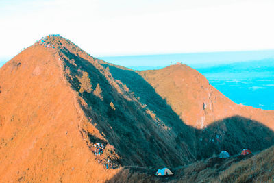 Panoramic view of mountain and sea against clear sky