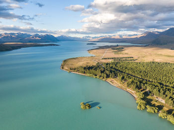 Drone view of lake tekapo on new zealand's south island. southern alps in the background.