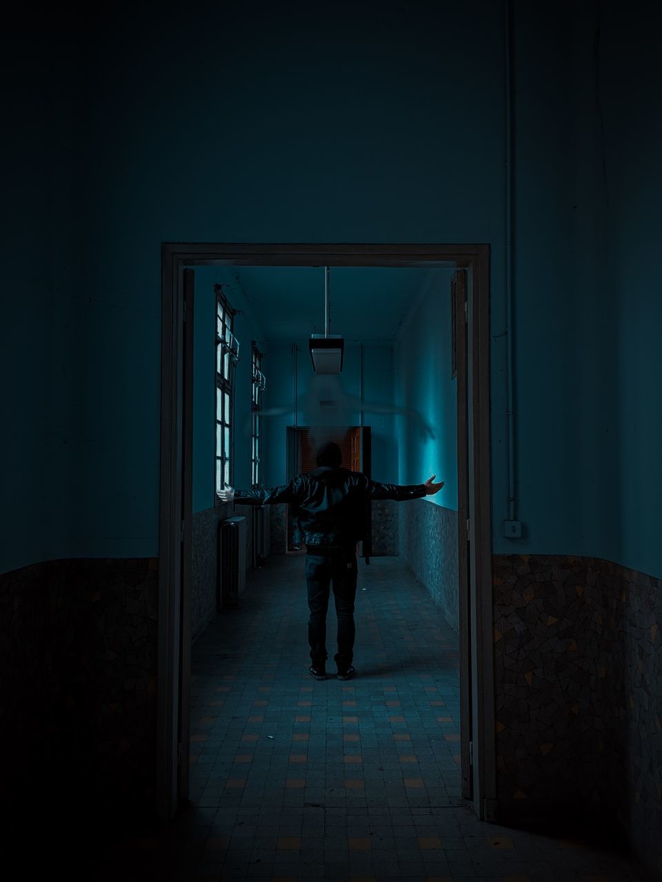 darkness, screenshot, light, one person, full length, blue, adult, indoors, night, standing, dark, architecture, door, men, entrance, domestic room