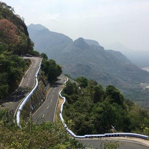 Country road leading towards mountains