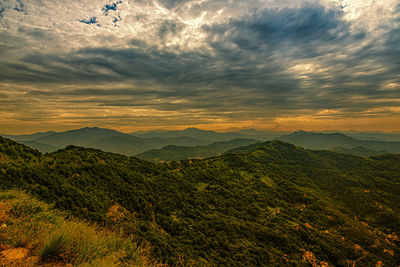 Scenic view of mountains against sky during sunset