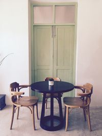 Chairs and table on door