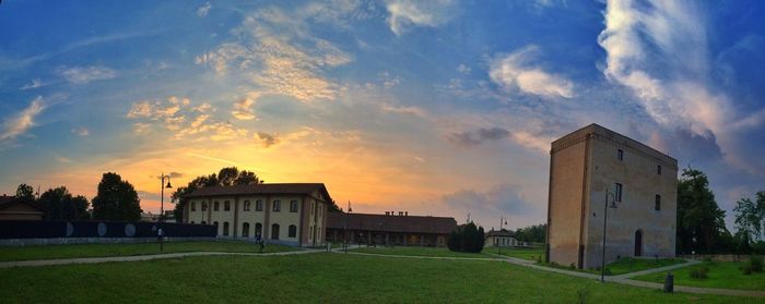 View of built structures against cloudy sky