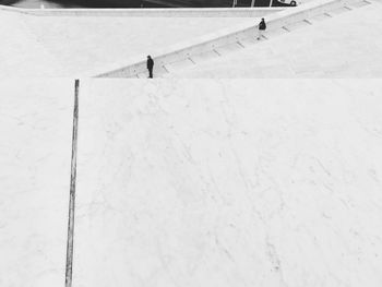 High angle view of people on snow covered field