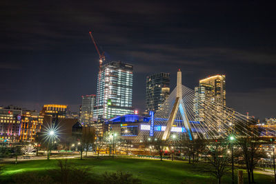 Illuminated city against sky at night