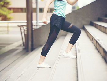 Low section of woman on footpath