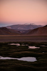 Scenic view of landscape against sky during sunset