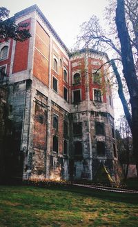 Low angle view of old building against sky