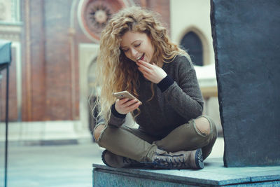 Young woman using mobile phone