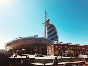 Low angle view of buildings against blue sky