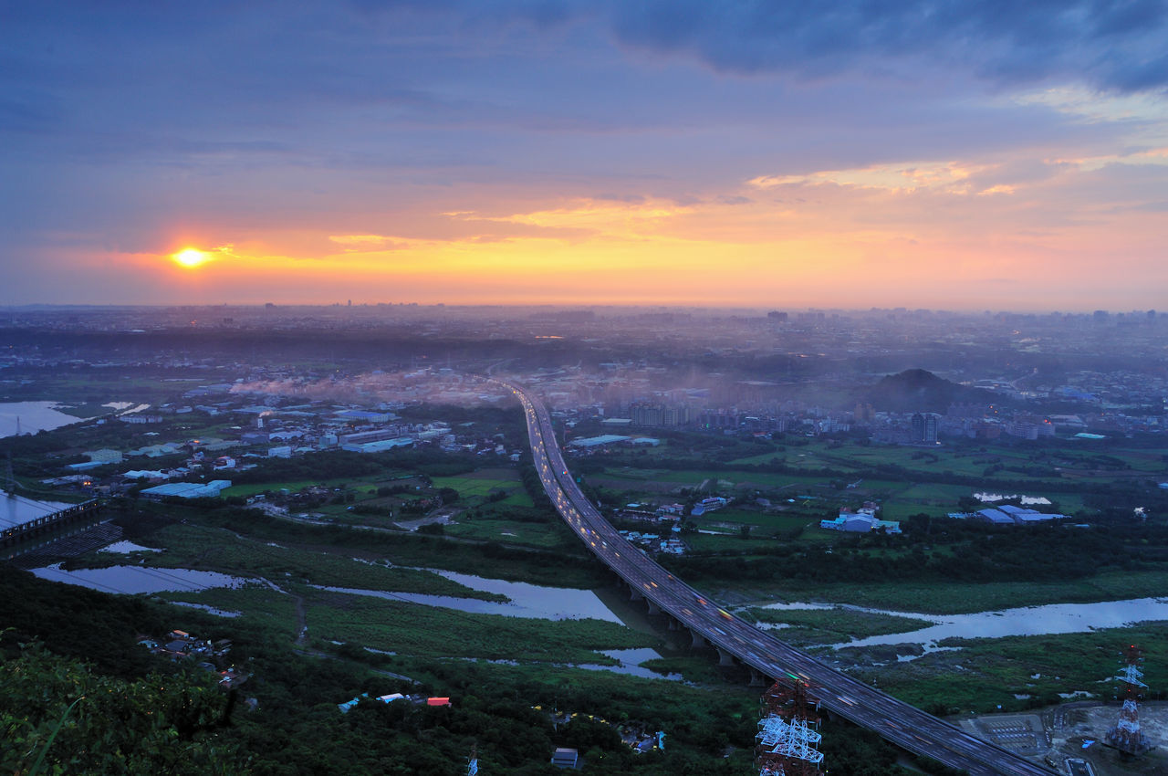 HIGH ANGLE VIEW OF CITY DURING SUNSET