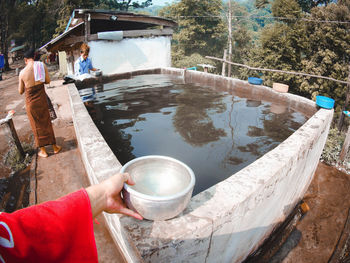 Midsection of woman working in water