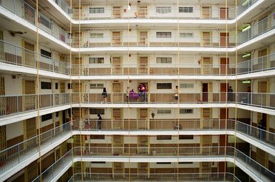 Low angle view of people in building