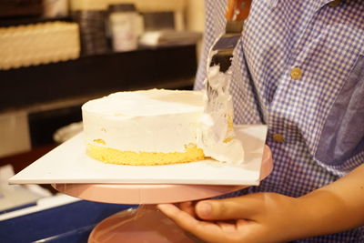 Midsection of man preparing food