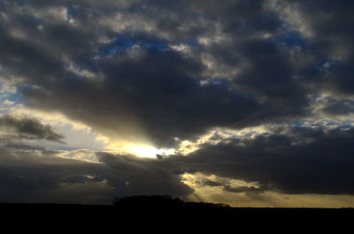 Low angle view of dramatic sky during sunset