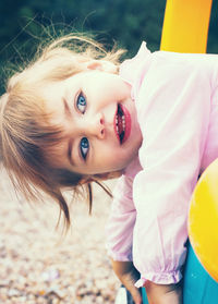 Close-up of cute girl playing at park