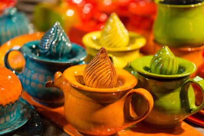 Christmas souvenirs on the counter in europe, glazed ceramic dishes on the market counter.