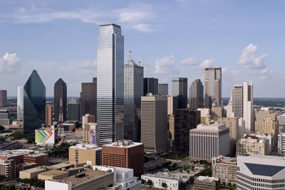 Buildings in city against sky