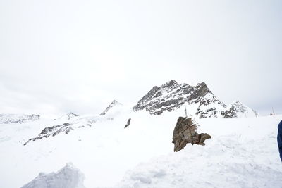 Scenic view of snow covered mountain against sky