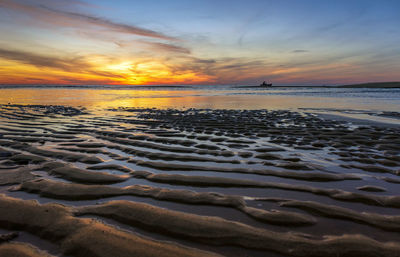 Scenic view of beach during sunset