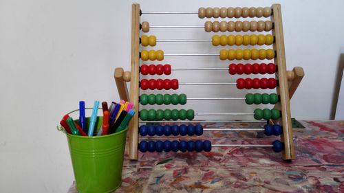 Close-up of multi colored equipment on table