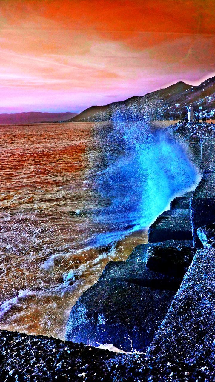 water, sea, scenics, beauty in nature, sky, sunset, nature, tranquil scene, rock - object, cloud - sky, horizon over water, wave, tranquility, idyllic, surf, rock formation, motion, orange color, splashing, tourism