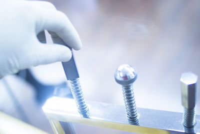 Cropped hand of doctor holding medical equipment