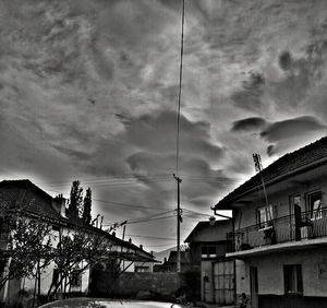 Low angle view of cables against sky