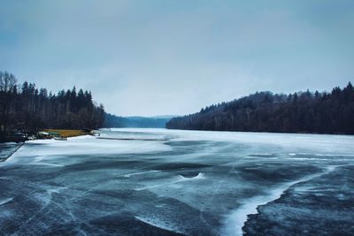 Scenic view of frozen lake against sky