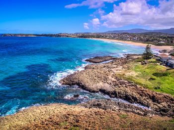 Scenic view of sea against blue sky