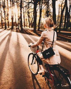 Rear view of woman riding bicycle