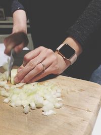 Close-up of man preparing food on table