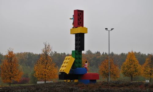 Information sign on field against sky during autumn